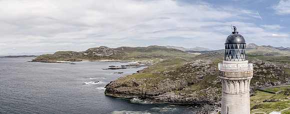 Stunning aerial shot of Ardnamurchan Point, Great Britains most westerly point, with lighthouse and the beautiful white beaches and costline in the background
