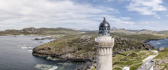 Stunning aerial shot of Ardnamurchan Point, Great Britains most westerly point, with lighthouse and the beautiful white beaches and costline in the background